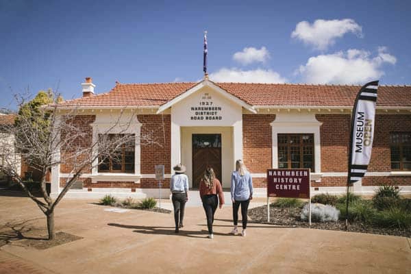 Image of 3 women walking into the Narembeen History Centre building